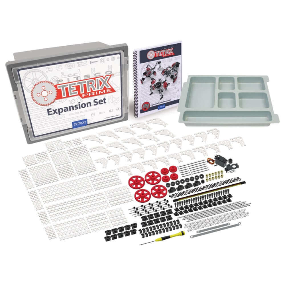 TETRIX PRIME Expansion Set with various parts, including wheels, connectors, and a project booklet for robotics.